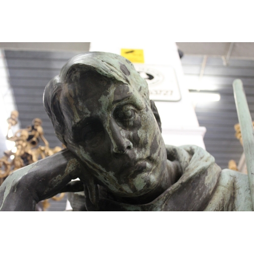 187 - ITALIAN CIRCA. 1875 A MASSIVE COPPER SCULPTURE OF SAINT FRANCIS OF ASSISI seated resting his head on... 