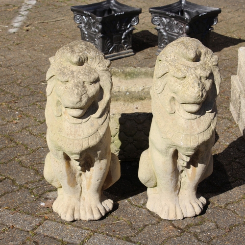 194 - A PAIR OF COMPOSITE FINIALS, modelled as lions. 26.5