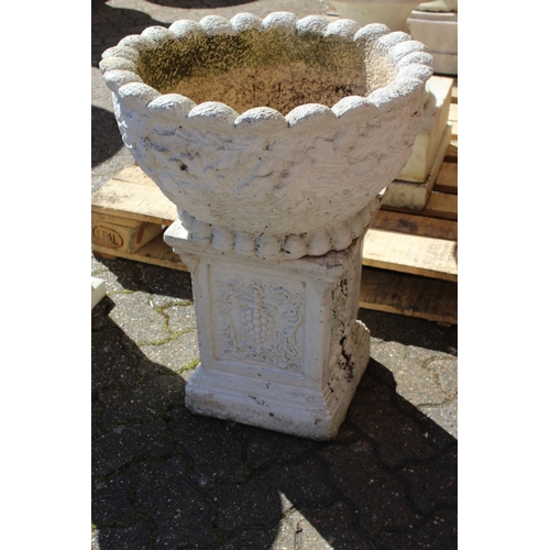 195 - A CIRCULAR GARDEN POT, the sides with acorns 1 ft 9 ins diameter