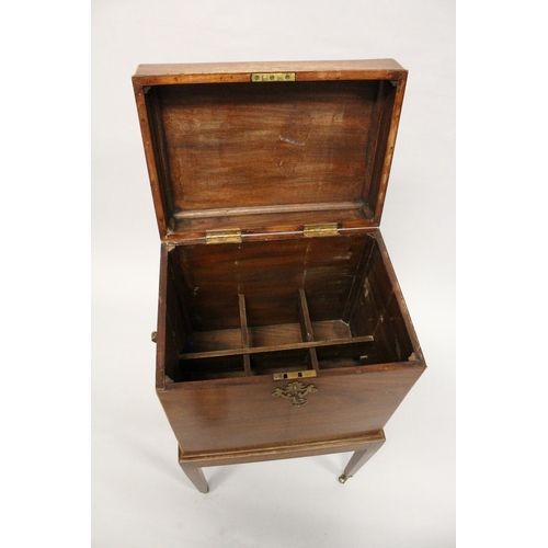 201 - AN EDWARDIAN MAGHOGANY CELLARETTE, with rising top, compartmented interior on a stand with tapering ... 