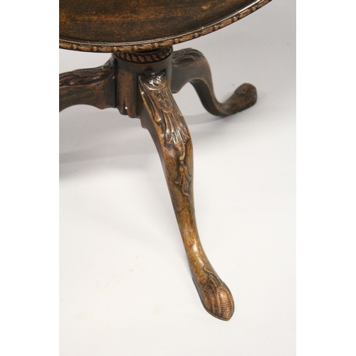 202 - A GEORGE III MAHOGANY CIRCULAR TILT TOP TRIPOD TABLE,  with dished top, turned vase shaped column on... 