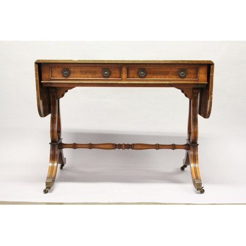 203 - A REGENCY STYLE MAHOGANY SOFA TABLE by E.G. HUDSON, WORTHING, with two frieze drawers, lyre end supp... 