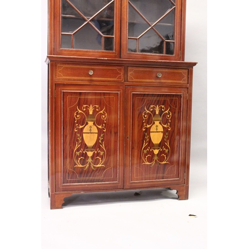 207 - AN EDWARDIAN MAHOGANY STANDING BOOKCASE, the top with swan neck pediment, pair of glazed doors over ... 