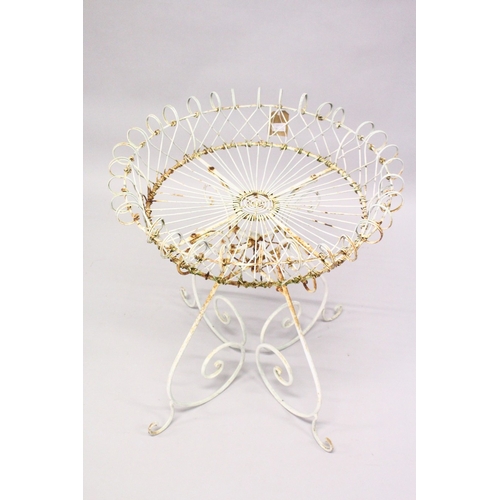 214 - A WHITE PAINTED WIRE CIRCULAR PLANT STAND. 2ft 4ins high x 2ft diameter.