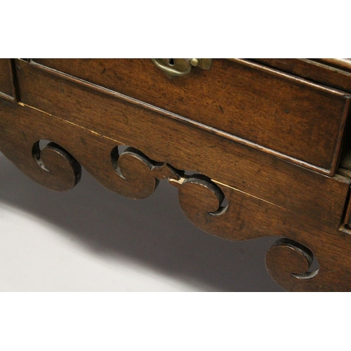 215 - AN 18TH CENTURY CHEST ON STAND with mould cornice, three frieze drawers over two short and two long,... 