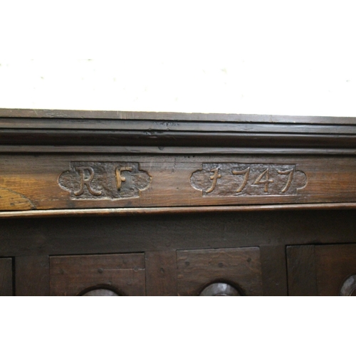 220 - AN 18TH CENTURY OAK DUODARN, the upper section with two arched panelled doors flanking a pair of arc... 