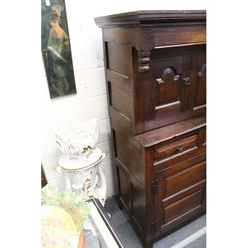 220 - AN 18TH CENTURY OAK DUODARN, the upper section with two arched panelled doors flanking a pair of arc... 