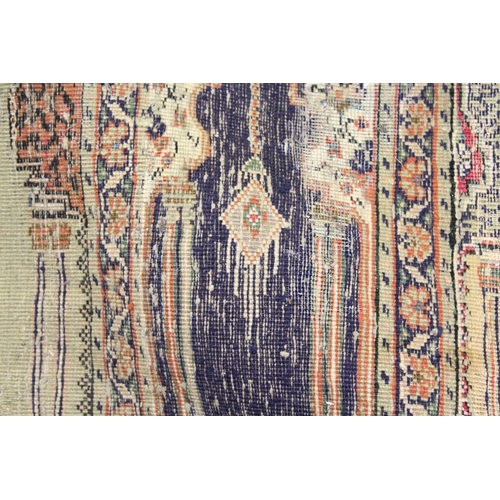 221 - AN UNUSUAL PERSIAN PRAYER RUG, the central panel with eight arches and hanging lamps, within a geome... 