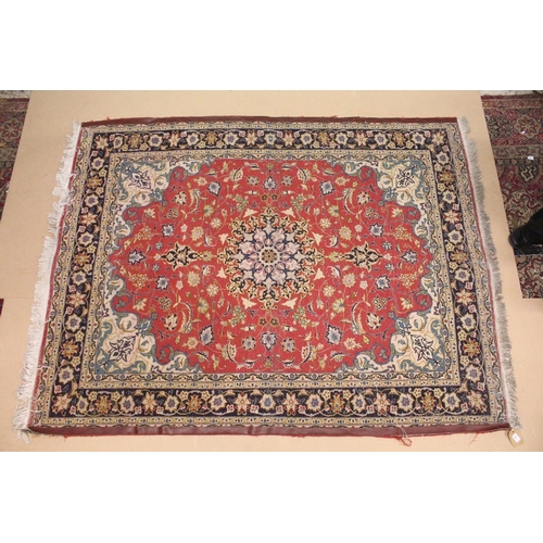 225 - A GOOD SMALL PERSIAN CARPET, red ground with all over floral decoration within a similar blue border... 