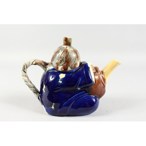 274 - A MINTON MAJOLICA STYLE CHINAMAN TEAPOT. 8.5ins long.