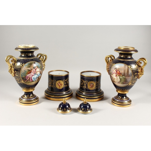 276 - A SUPERB PAIR OF VIENNA VASES, COVERS AND STANDS, the rich blue ground edged in gilt and painted wit... 