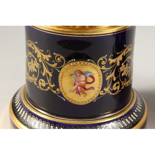 276 - A SUPERB PAIR OF VIENNA VASES, COVERS AND STANDS, the rich blue ground edged in gilt and painted wit... 