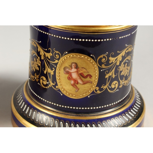 276 - A SUPERB PAIR OF VIENNA VASES, COVERS AND STANDS, the rich blue ground edged in gilt and painted wit... 