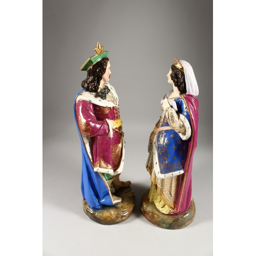 277 - A LARGE PAIR OF PARIS PORCELAIN FIGURES OF A TURKISH MAN holding a sword and a young lady. 16ins hig... 