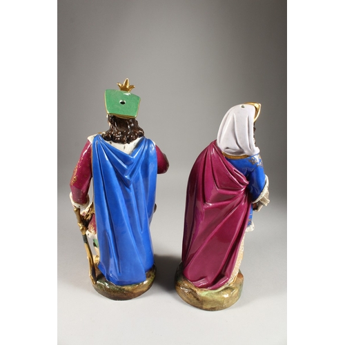 277 - A LARGE PAIR OF PARIS PORCELAIN FIGURES OF A TURKISH MAN holding a sword and a young lady. 16ins hig... 