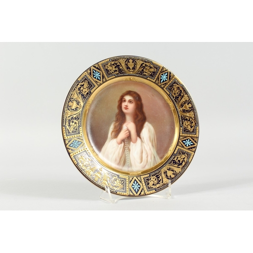 286 - A GOOD VIENNA CIRCULAR PLATE, blue and gilt border, the centre painted with a portrait  'Aspiration'... 