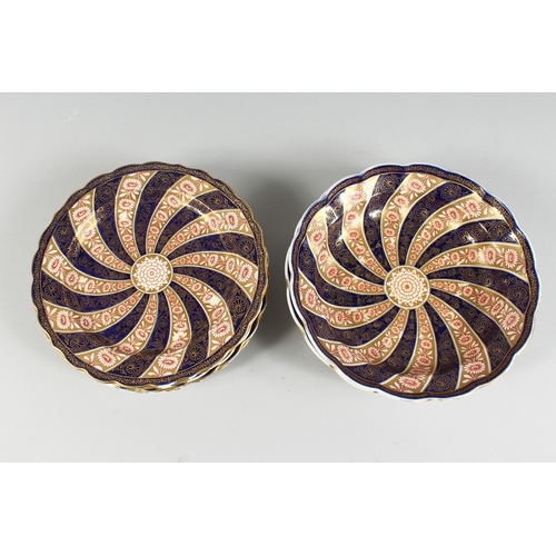 296 - A SET OF  SIX WORCESTER SWIRL PATTERN BLUE AND GILT PLATES. 9 ins diameter and  three deep dishes 9 ... 