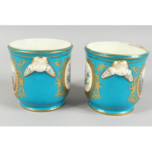 303 - A GOOD PAIR OF SEVRES BLUE GROUND CACHE POTS 4.5 ins high with scroll handles and painted with rever... 