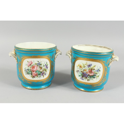 303 - A GOOD PAIR OF SEVRES BLUE GROUND CACHE POTS 4.5 ins high with scroll handles and painted with rever... 