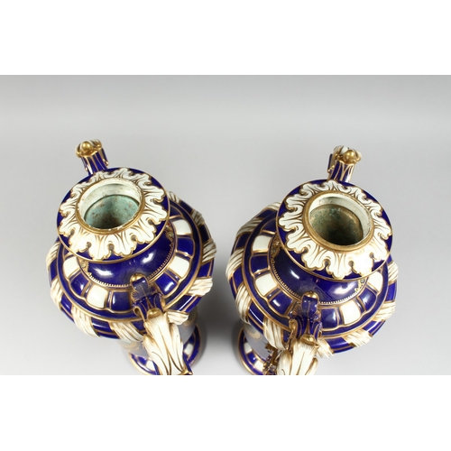 307 - A SUPERB LARGE PAIR OF SEVRES TWO HANDLED VASES AND COVERS, rich blue and white ground edged in gilt... 