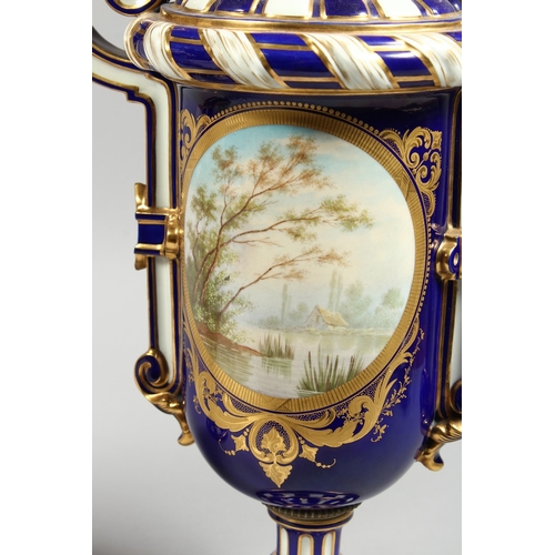 307 - A SUPERB LARGE PAIR OF SEVRES TWO HANDLED VASES AND COVERS, rich blue and white ground edged in gilt... 