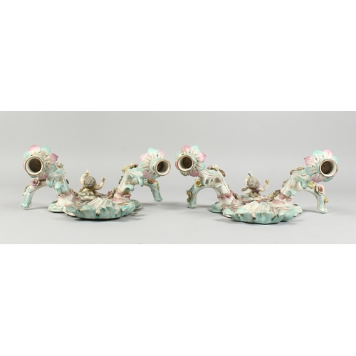 308 - A GOOD PAIR OF MEISSEN PORCELAIN TWO LIGHT WALL SCONCES with cupid and encrusted with flowers and pa... 