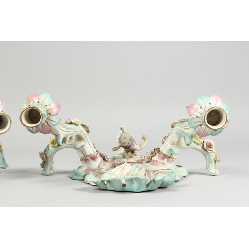 308 - A GOOD PAIR OF MEISSEN PORCELAIN TWO LIGHT WALL SCONCES with cupid and encrusted with flowers and pa... 