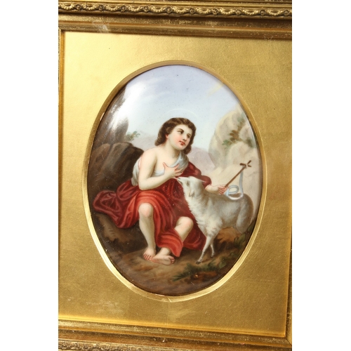 312 - A GOOD CONTINENTAL OVAL PORCELAIN PLAQUE, young boy with a lamb, behind glass in a gilt frame. 4.5 x... 