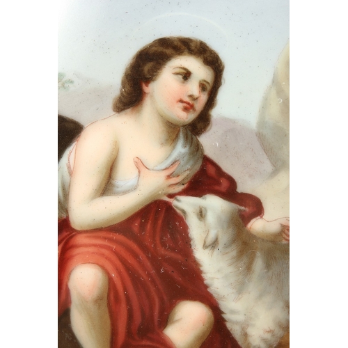 312 - A GOOD CONTINENTAL OVAL PORCELAIN PLAQUE, young boy with a lamb, behind glass in a gilt frame. 4.5 x... 