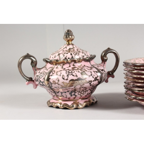 315 - A ROSENTHAL SILVER OVERLAID PINK PORCELAIN TEA SET comprising ten cups and saucers, sugar basin and ... 