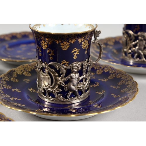 318 - A  SET OF FIVE ROYAL VIENNA BLUE AND GILT CUPS AND SIX SAUCERS with silver handles