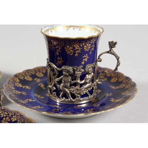 318 - A  SET OF FIVE ROYAL VIENNA BLUE AND GILT CUPS AND SIX SAUCERS with silver handles