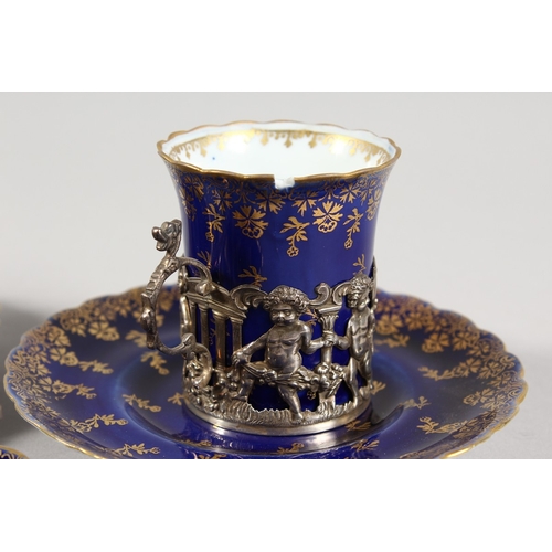 318 - A  SET OF FIVE ROYAL VIENNA BLUE AND GILT CUPS AND SIX SAUCERS with silver handles