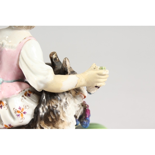 321 - A 19TH CENTURY MEISSEN STYLE PORCELAIN GROUP OF A BOY AND GIRL holding grapes, with a goat. 6 ins hi... 