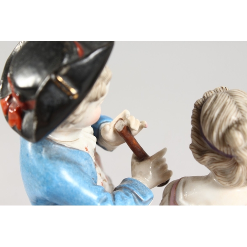 321 - A 19TH CENTURY MEISSEN STYLE PORCELAIN GROUP OF A BOY AND GIRL holding grapes, with a goat. 6 ins hi... 