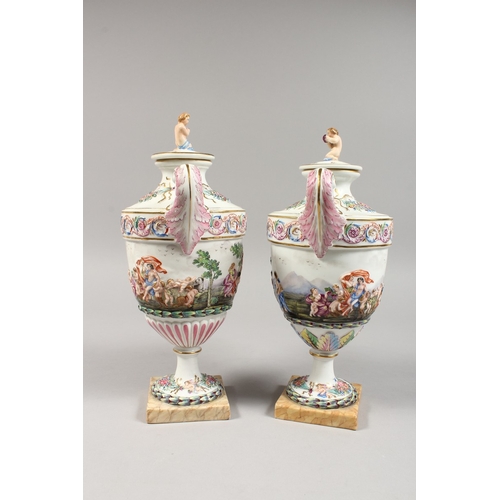 325 - A GOOD PAIR OF CAPODIMONTE URN SHAPED, TWO HANDLED VASES AND COVERS  with classical figures in relie... 