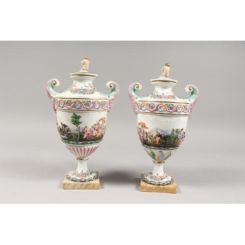 325 - A GOOD PAIR OF CAPODIMONTE URN SHAPED, TWO HANDLED VASES AND COVERS  with classical figures in relie... 