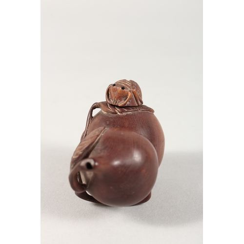 335 - A JAPANESE CARVED WOOD FRUIT BOTTLE