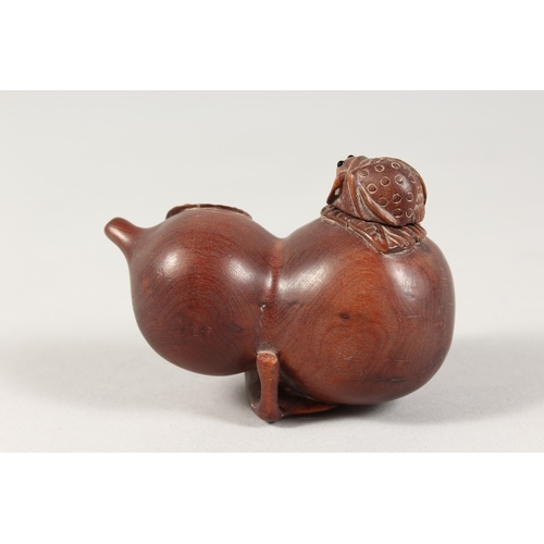 335 - A JAPANESE CARVED WOOD FRUIT BOTTLE