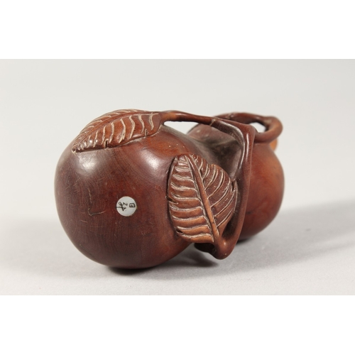 335 - A JAPANESE CARVED WOOD FRUIT BOTTLE