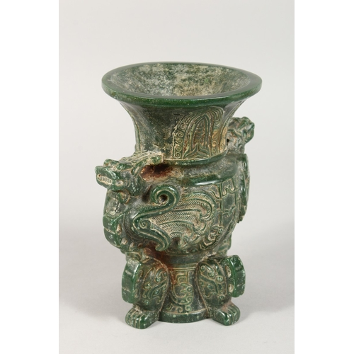 338 - A CHINESE CARVED GREEN STONE ARCHAIC DRAGON VASE 7 ins, high