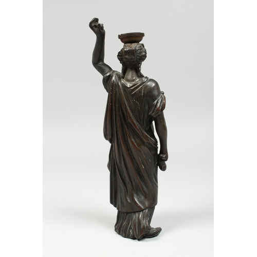 345 - AFTER THE ANTIQUE A BRONZE OF A CLASSICAL FIGURE, arm raised, 10 ins high.