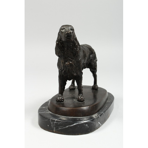 346 - A BRONZE SPANIEL on a marble base, 6 ins long.