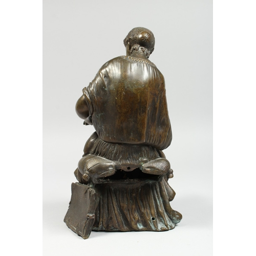 347 - A CLASSICAL BRONZE SEATED FIGURE reading a book, 10 ins high.