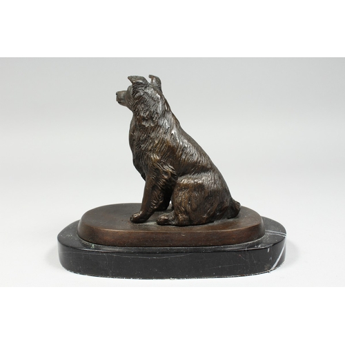 348 - A BRONZE DOG on a marble base. 5 ins high.