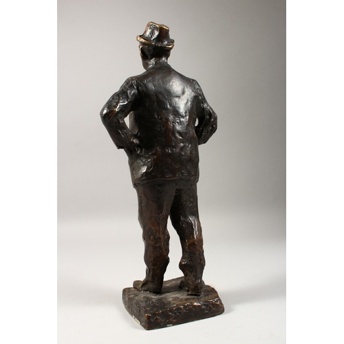 355 - PAOLO TROUBETZKOY (1866-1938) RUSSIAN A CAST BRONZE OF A MAN STANDING HANDS ON HIPS, smoking a cigar... 