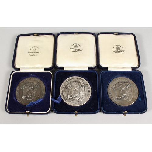 771 - HEREFORD HERD BOOK SOCIETY  THREE SILVER MEDALLIONS won by Sir D.R. Llewellyn, in a Mappin and Webb ... 