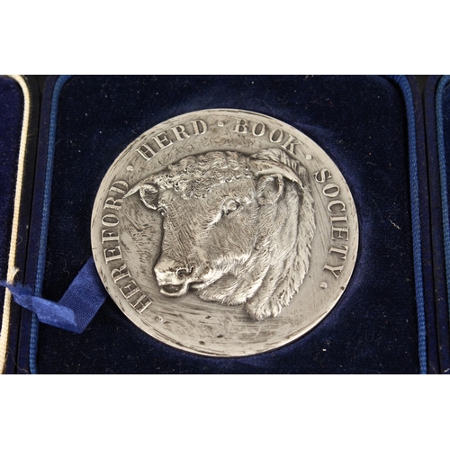 771 - HEREFORD HERD BOOK SOCIETY  THREE SILVER MEDALLIONS won by Sir D.R. Llewellyn, in a Mappin and Webb ... 