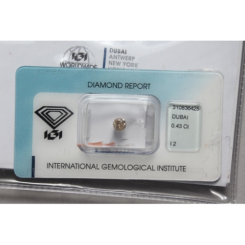 792 - A SINGLE STONE DIAMOND, 0.43 carat, colour light brown, clarity 12 with diamond report.