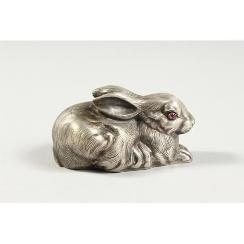 A SMALL RUSSIAN SILVER RABBIT with ruby eyes, stamped head, '84 Faberge'